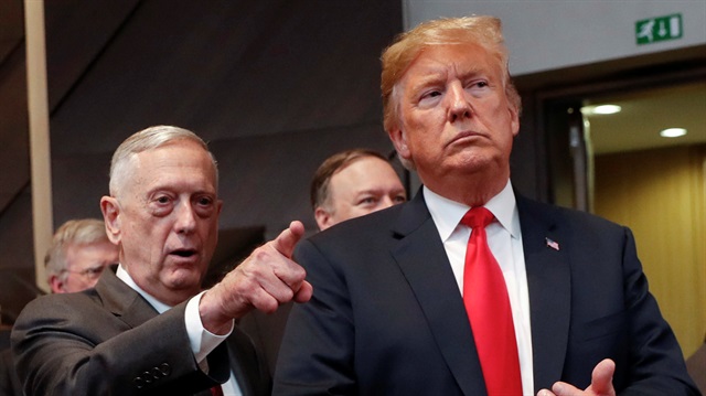 File photo: U.S. President Donald Trump walks in with U.S. Defense Secretary Jim Mattis as they arrive to attend the multilateral meeting of the North Atlantic Council in Brussels, Belgium 