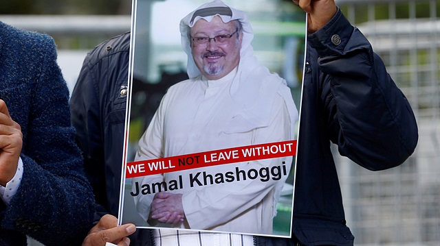 A demonstrator holds picture of Saudi journalist Jamal Khashoggi