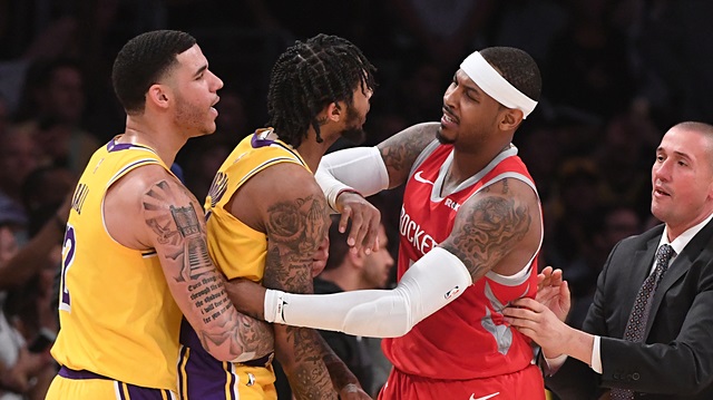 Los Angeles Lakers guard Lonzo Ball (2) and Houston Rockets forward Carmelo Anthony (7) restrain Los Angeles Lakers forward Brandon Ingram (14) after a fight in the fourth quarter of the game at Staples Center.