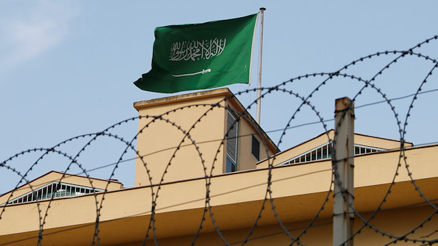 A Saudi flag flutters atop Saudi Arabia's consulate in Istanbul, Turkey.