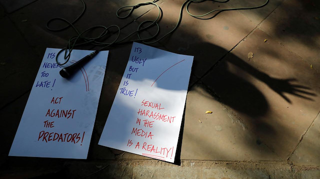 A microphone and placards are placed on the pavement as Indian journalists attend a protest against what they say is sexual harassment in the workplace in New Delhi, India, October 13, 2018. 