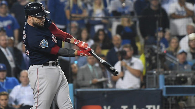 Boston Red Sox first baseman Steve Pearce (25) hits a three RBI double in the ninth inning against the Los Angeles Dodgers in game four of the 2018 World Series at Dodger Stadium.