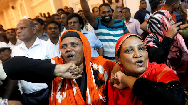 Supporters of Sri Lanka's ousted Prime Minister Ranil Wickremesinghe shout inside the Prime Minister office in Colombo, Sri Lanka October 27, 2018. 