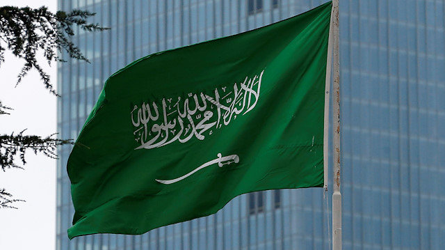 A Saudi flag flutters atop Saudi Arabia's consulate in Istanbul, Turkey.