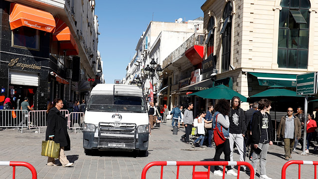 Civilians walk near the site of an explosion that occurred yesterday in Tunis, Tunisia October 30, 2018. 