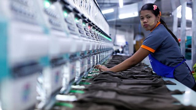 A labourer works at a garment factory in Bangkok, Thailand.