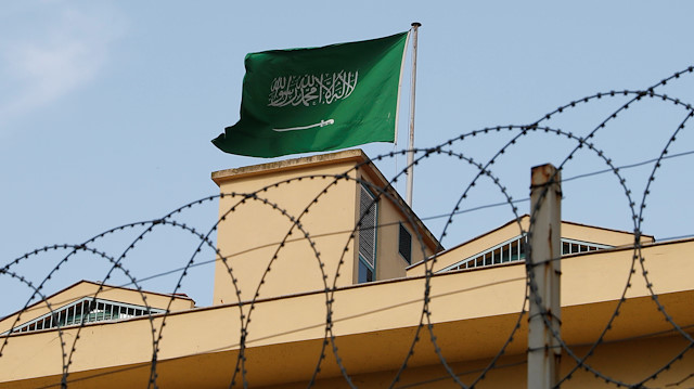 A Saudi flag flutters atop Saudi Arabia's consulate in Istanbul, Turkey