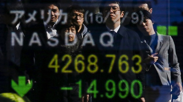 Asian shares sell-off as risk sentiment sours, pound pares gains