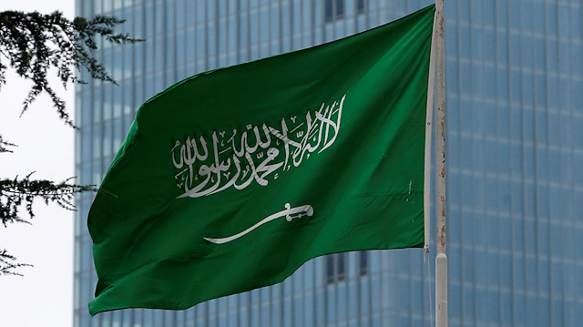  A Saudi flag flutters atop Saudi Arabia's consulate in Istanbul, Turkey.