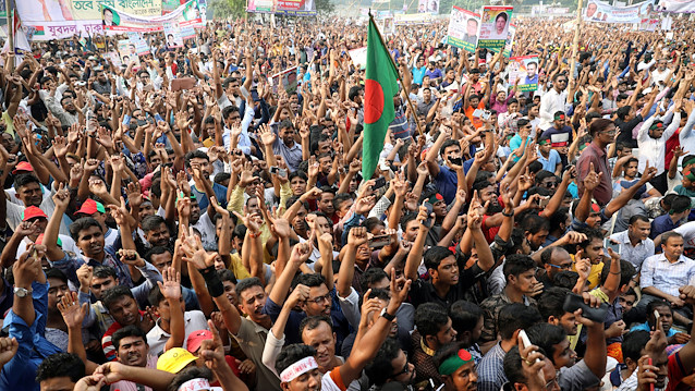 People shout slogan as they gather at the Suhrawardy Udyan for the maiden rally of opposition alliance called Jatiya Oikyafront in Dhaka, Bangladesh