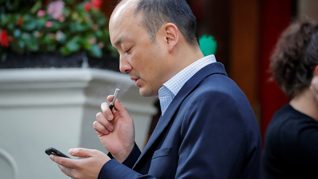 A man smokes an e-cigarette in New York, U.S.