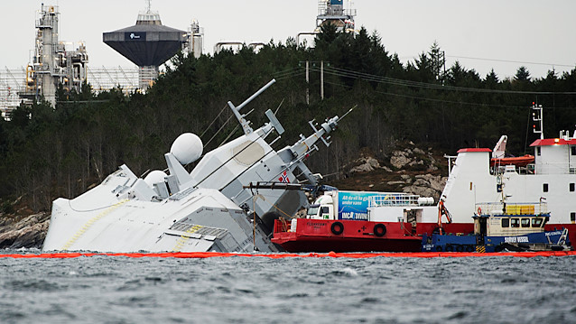 The Norwegian frigate "KNM Helge Ingstad" takes on water after a collision with the tanker "Sola TS" in Oygarden, Norway, November 10, 2018.