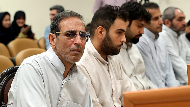 Vahid Mazloumin is seen appearing in court for the first time on charges of manipulating the currency market. He was later sentenced to death, in Tehran, Iran.
