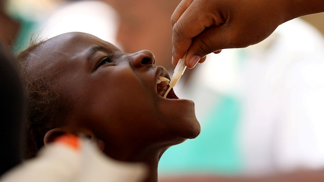 A child receives a cholera vaccination at a clinic in Harare, Zimbabwe, October 4, 2018. 