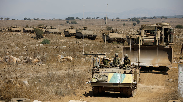 Israeli armoured vehicles take part in an army drill during a visit of Israeli Defence Minister Avigdor Lieberman in the Israeli-occupied Golan Heights 