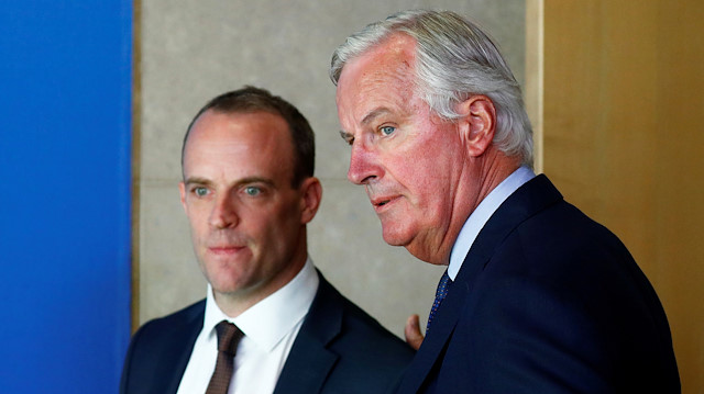 Britain's Secretary of State for Exiting the European Union, Dominic Raab and European Union's chief Brexit negotiator, Michel Barnier look on as they arrive for a media briefing at the EU Commission headquarters in Brussels, Belgium August 21, 2018. 