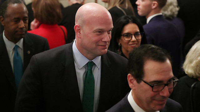 Acting U.S. Attorney General Matthew Whitaker departs between U.S. Treasury Secretary Steven Mnuchin (R) and Housing and Urban Development Secretary Ben Carson (L) after a ceremony where President Donald Trump awarded the 2018 Presidential Medals of Freedom in the East Room of the White House in Washington, US.