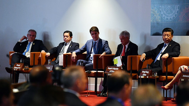 Australia's Prime Minister Scott Morrison, Canada's Prime Minister Justin Trudeau (C) and China's President Xi Jinping at APEC Haus during the 2018 Asia-Pacific Economic Cooperation (APEC) forum in Port Moresby, Papua New Guinea.