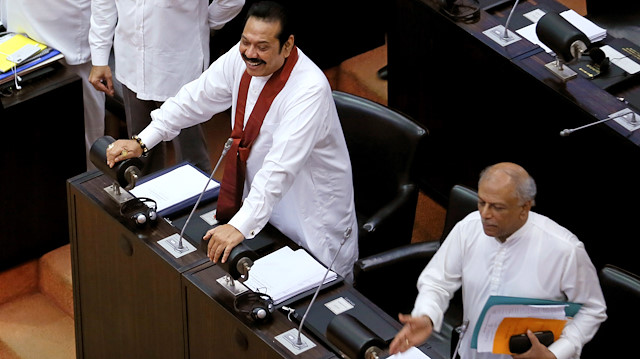 Sri Lanka's newly appointed Prime Minister Mahinda Rajapaksa looks on before leaves the parliament in Colombo, Sri Lanka November 19, 2018. 