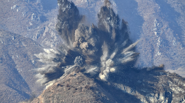 A North Korea's guard post in the demilitarized zone is blown up in this picture taken from South Korea's territory, November 20, 2018.
