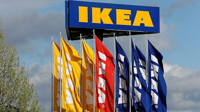  Flags and the company's logo are seen outside of an IKEA Group store in Spreitenbach, Switzerland

