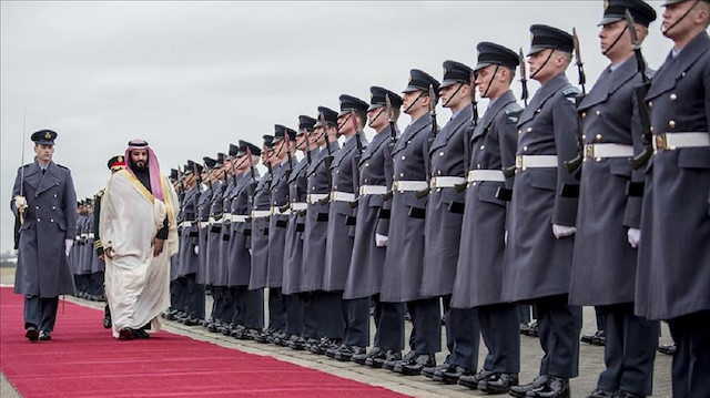 Crown Prince and Defense Minister of Saudi Arabia Mohammad bin Salman al-Saud (2nd L) walks past the honor guards during an official welcoming ceremony by British Secretary of State for Defence, Gavin Williamson (not seen) in London, United Kingdom on March 09, 2018. 