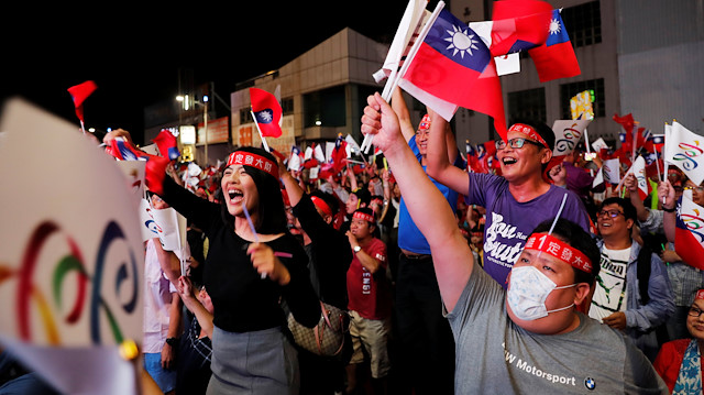Supporters of Opposition Nationalist Kuomintang Party (KMT) Kaohsiung mayoral candidate Han Kuo-yu celebrate as their candidate announces a leading trend during local elections in the poll, in Kaohsiung, Taiwan November 24, 2018.