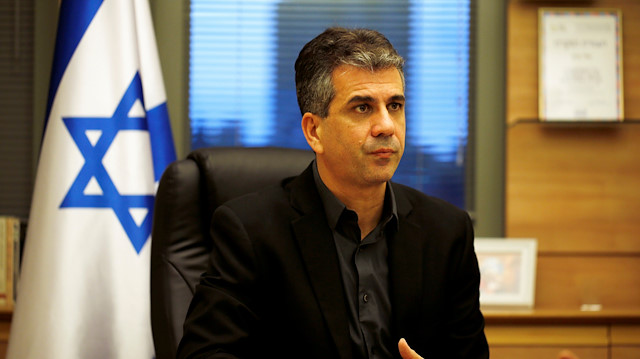 Israel's Economy Minister Eli Cohen works at his office in the Knesset, the Israeli parliament, in Jerusalem.