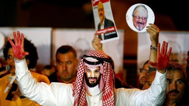 A demonstrator wearing a mask of Saudi Crown Prince Mohammed bin Salman 