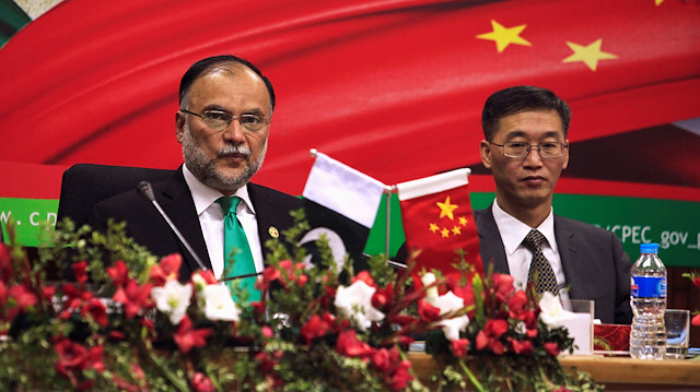 Ahsan Iqbal (L), Pakistan's Minister of Planning and Development and Yao Jing