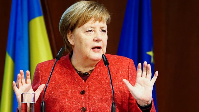 German Chancellor Angela Merkel gestures as she speaks 