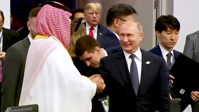 Saudi Arabia's Crown Prince Mohammed bin Salman greets Russia's President Vladimir Putin 