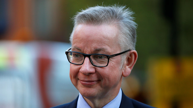 Britain's Secretary of State for Environment, Food and Rural Affairs, Michael Gove leaves his office in London, Britain.