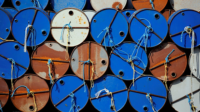 Oil barrels are pictured at the site of Canadian group Vermilion Energy 