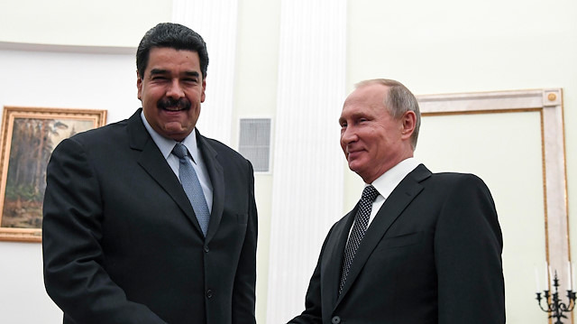 Russian President Vladimir Putin (R) shakes hands with his Venezuelan counterpart Nicolas Maduro during a meeting at the Kremlin in Moscow, Russia.