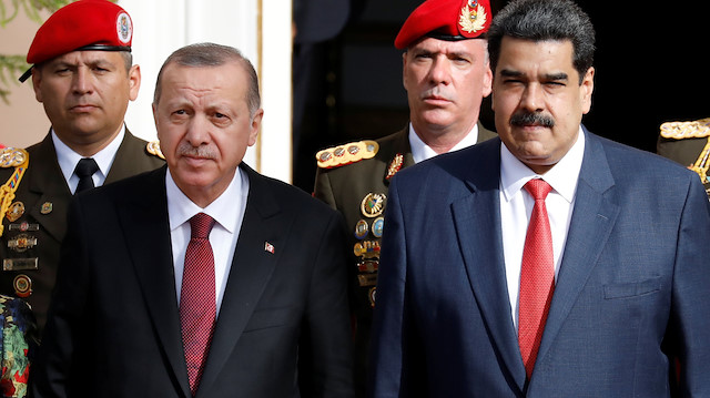 Turkish President Tayyip Erdoğan receives military honours upon his arrival at Miraflores Palace, next to Venezuela's President Nicolas Maduro in Caracas, Venezuela December 3, 2018. 