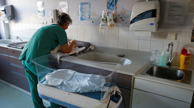 A nurse checks a child in a delivery room at the Hospital Roland Mazoin in Saint-Junien