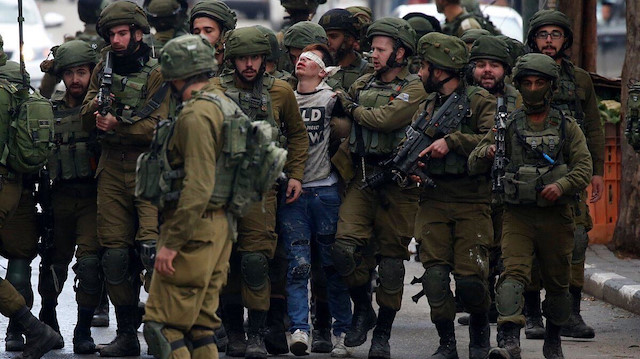 Geçen sene bugün 22 İsrail askerinin korkuyla gözaltına aldığı Cuneydi, bu fotoğrafla kamuoyunun en çok konuştuğu isimlerin başındaydı.
