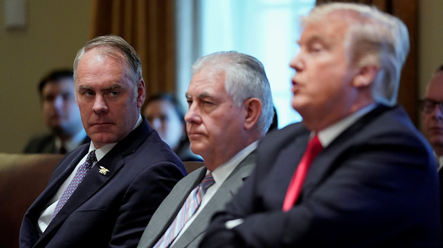 U.S. Interior Secretary Ryan Zinke (L) looks on with Secretary of State Rex Tillerson 