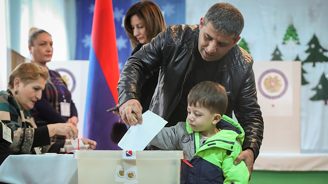 A man votes during an early parliamentary election in Yerevan, Armenia.