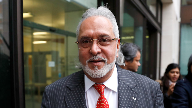 Vijay Mallya has a break outside the court house as he waits for his extradition case to be heard at Westminster Magistrates Court, in London, Britain, December 10, 2018