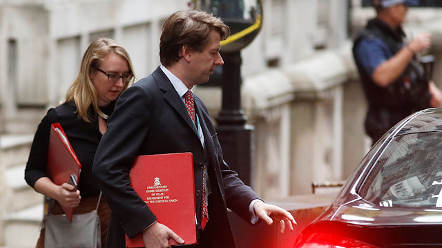 Robin Walker, junior minister at the Department for Exiting the Eurpean Union, holds his ministerial folder as he leaves Downing Street in London, Britain.