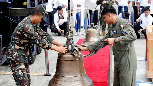 Philippine Air Force personnel unload the bells of Balangiga after their arrival at Villamor Air Base in Pasay, Metro Manila, Philippines.