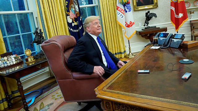 U.S. President Donald Trump sits down for an exclusive interview with Reuters journalists in the Oval Office at the White House in Washington, U.S. December 11, 2018. 