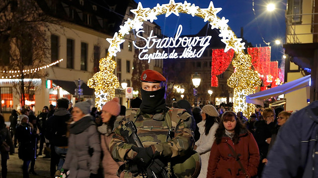 A soldier patrols as tourists arrive to visit the traditional Christkindelsmaerik (Christ Child market) in Strasbourg November 28, 2015 as the security measures in public places is reinforced after recent deadly attacks in Paris