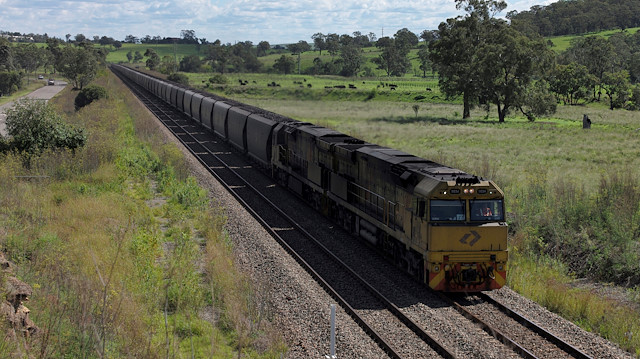 An Aurizon coal train travels through the countryside in Muswellbrook, north of Sydney, Australia, April 9, 2017.