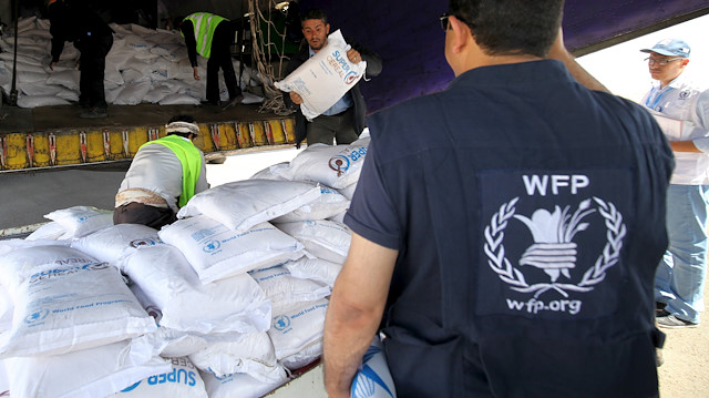 A World Food Programme employee arranges aid