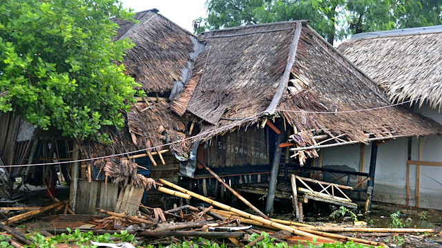 A house and a small shop is seen after hit by tsunami at Tanjung Lesung district in Pandeglang, Banten province, Indonesia