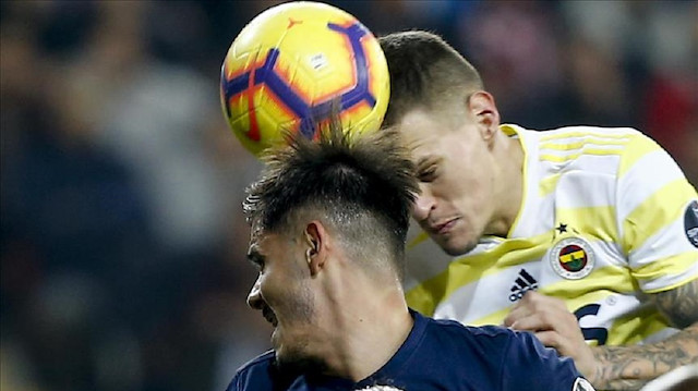 Martin Skrtel (R) of Fenerbahce rises for a high ball during the Turkish Super Lig football match between Antalyaspor and Fenerbahce at the Antalya Stadium in Antalya, Turkey.