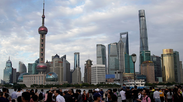 File photo: People visit the Bund in front of Shanghai's financial district of Pudong in Shanghai